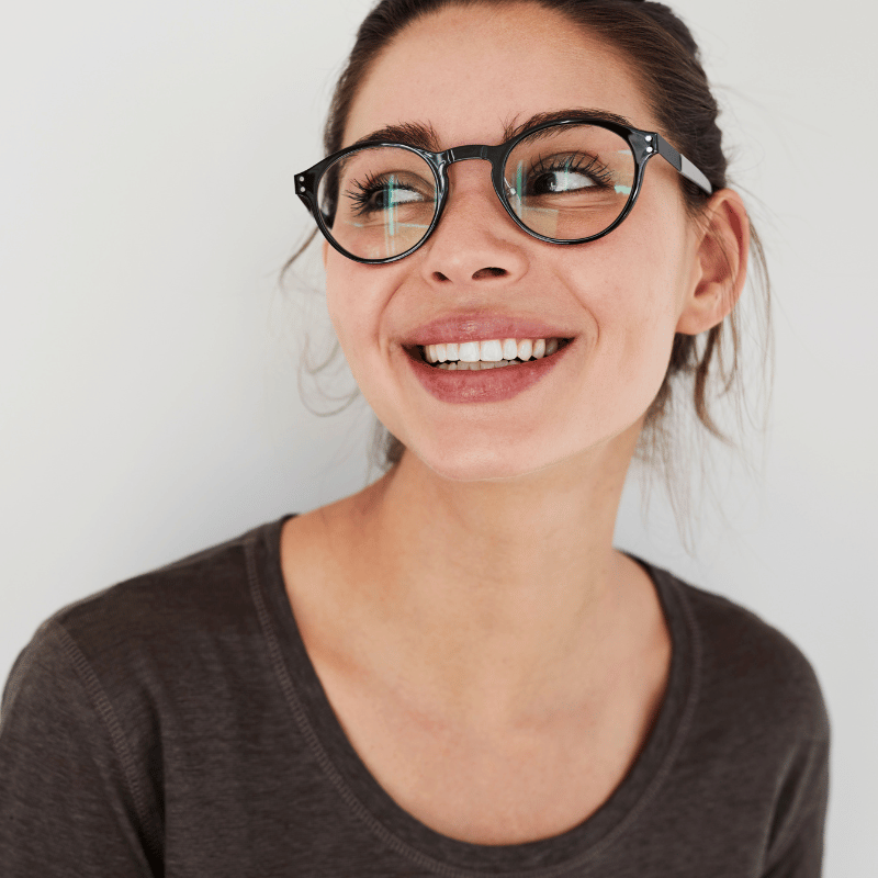 Young female wearing glasses and smiling