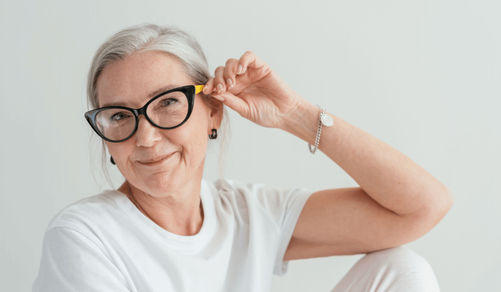 Senior woman confidently wearing glasses