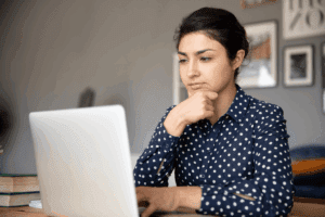 Female looking at a computer screen for an eye exam