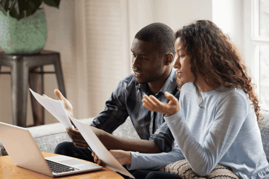 Couple sitting at a table and reviewing vision insurance paperwork