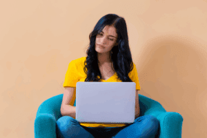 Woman sitting on a chair and working on her computer