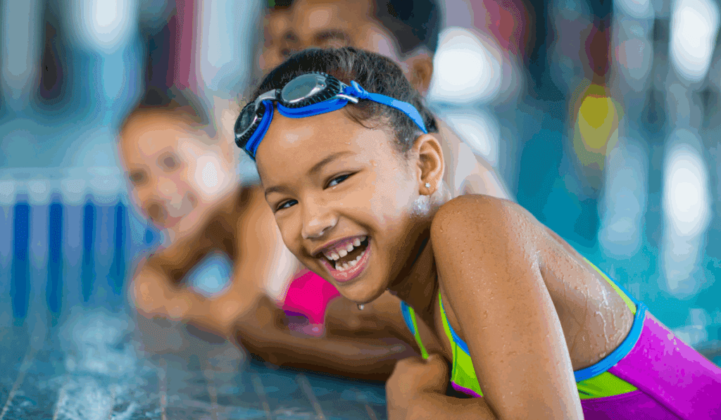 Group of children swimming at an indoor pool