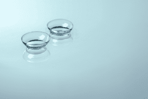 Pair of contact lenses on a blue table