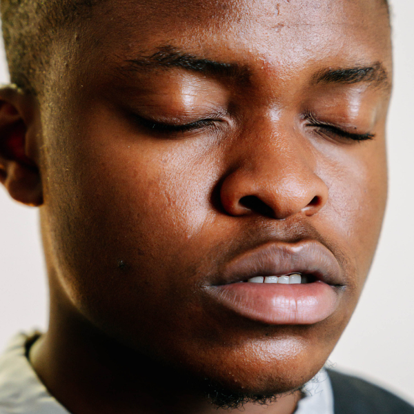Man closing his eyes