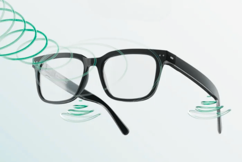 Glasses with built-in hearing aids and rings indicating sound and light waves