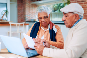 Senior couple reviewing Medicare insurance paperwork