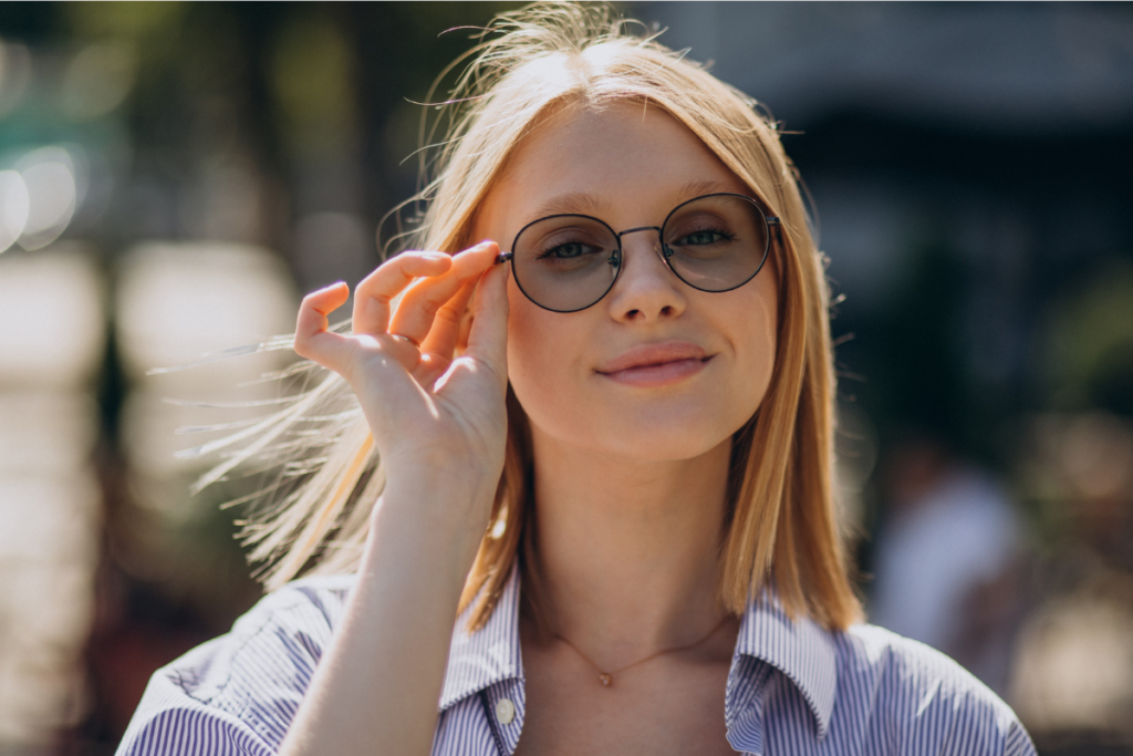 Young woman wearing transition lenses outside