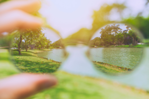 Pair of glasses with blurry landscape in the background