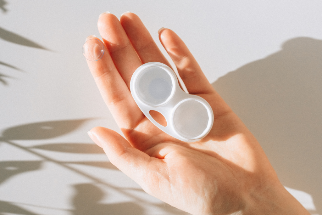 Woman's palm holding a contact lens case